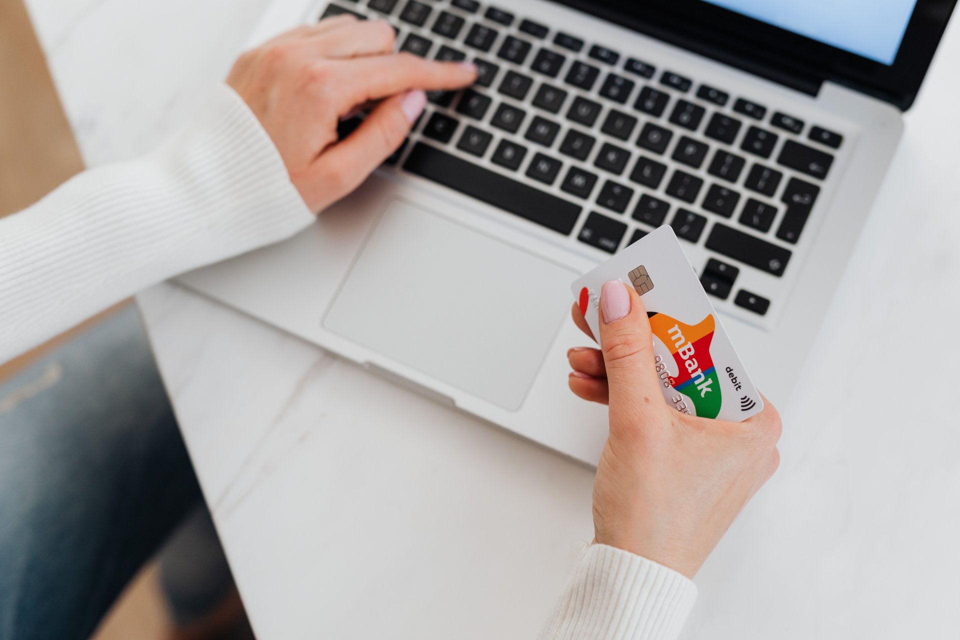 Payment cards next to a laptop keyboard