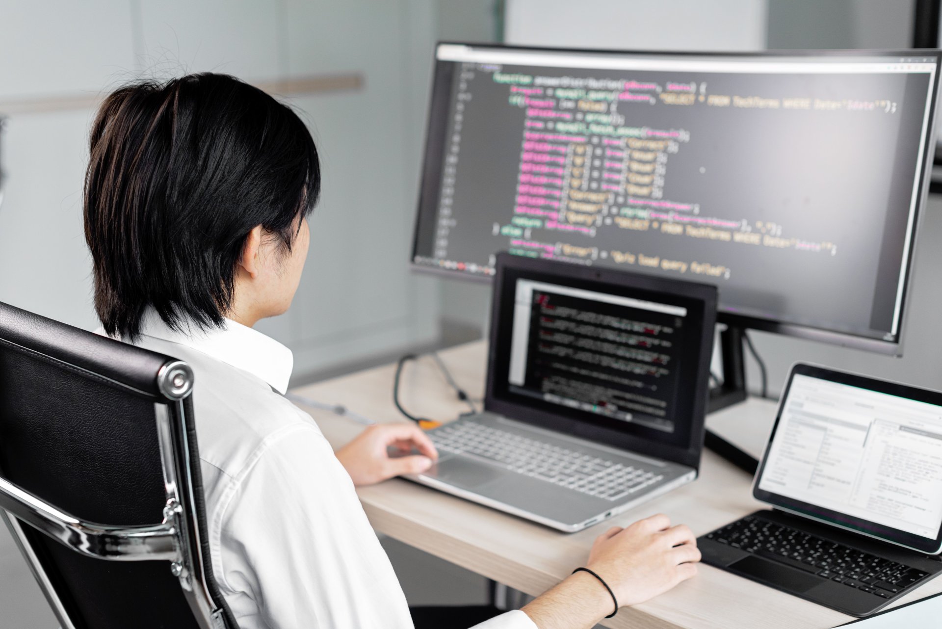 Developer working through test code on screen
