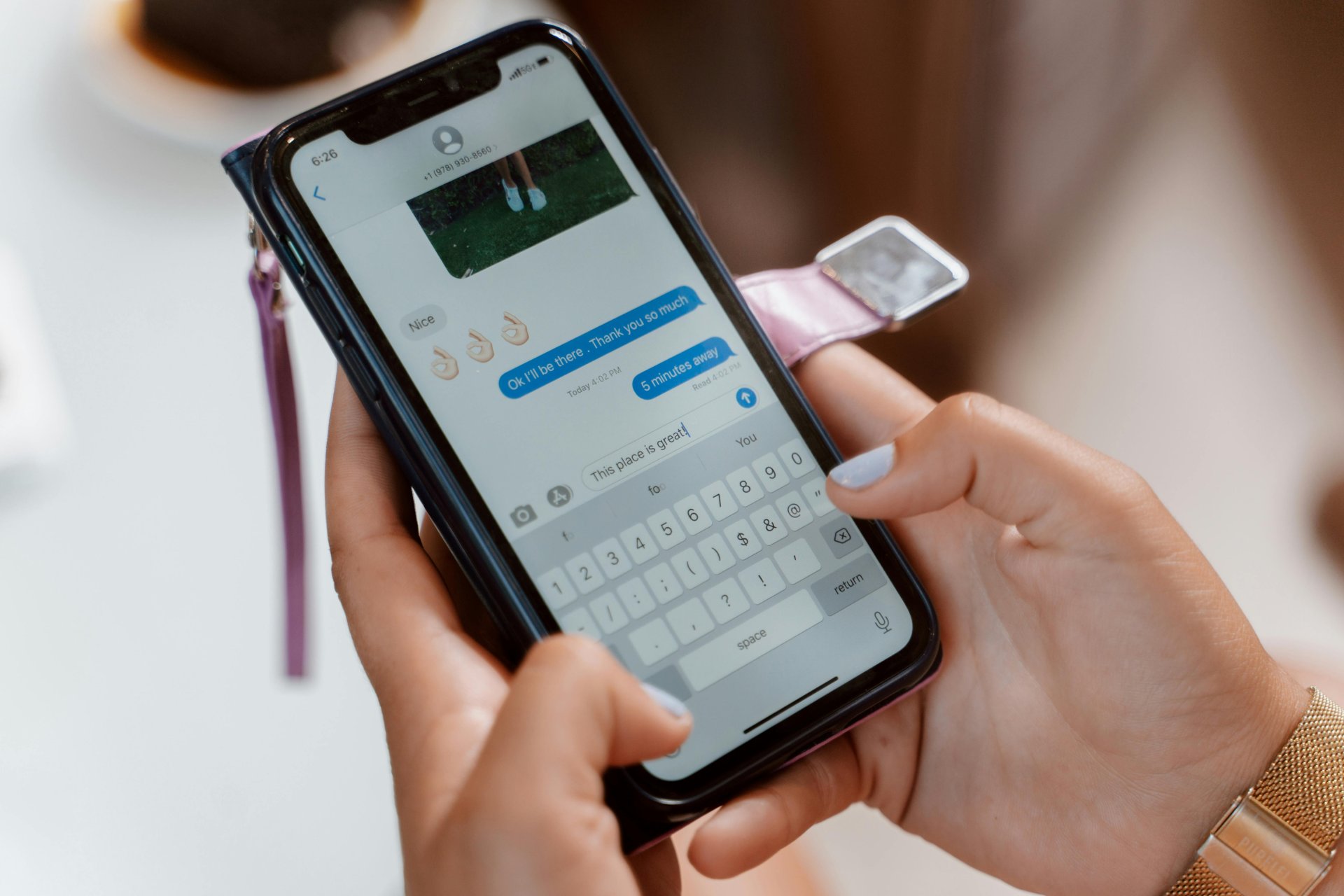 Person typing on smartphone